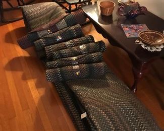 Additional braided rugs! Numerous rocking chairs!