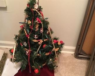 Small Christmas table top tree, decorated, with tree skirt