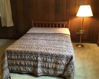 Full bed with standing lamp