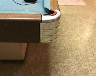 Metal curved corners on pool table