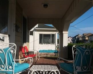 porch furniture - two chairs, two side tables, love seat. White iron from Pier One