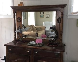Buffet used in entry - beveled mirror, copper pulls, beautiful carvings