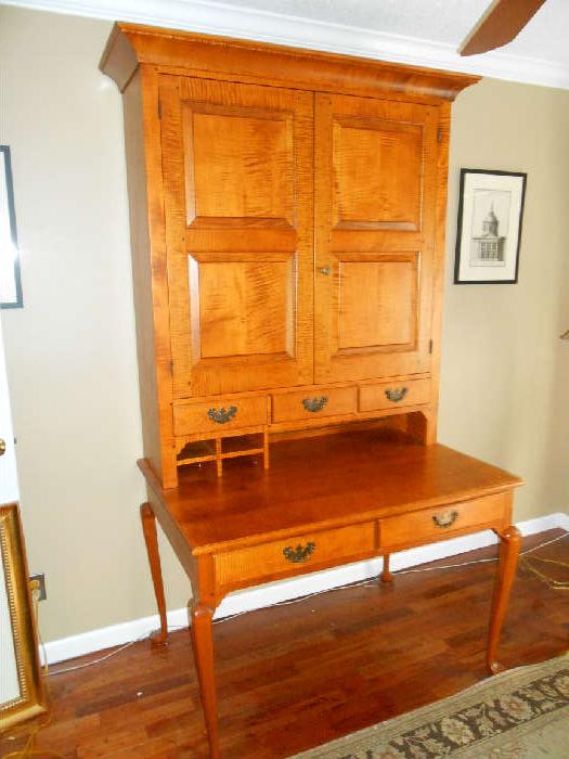 David T. Smith curly maple Plantation Desk is actually two parts:
-Lower desk part has two drawers:  
47" width x 32" deep x 31" tall-Upper hutch has two doors/three drawers/one organizer on left:
44-l/2" width x 17" deep crown to back x 55" tall-Interior of hutch has adjustable shelves