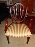 One of the two BAKER arm chairs; there are also two BAKER side chairs.