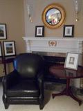 ARHAUS black leather occasional chair and the round BAKER table.
(Note:  the mirror and wall sconces are NOT for sale.)
