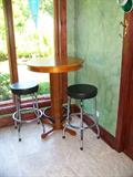 accent table and two bar stools