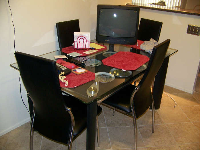 4 leather  chairs and chrome kitchen set