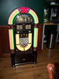 CROSLEY COMPACT DIGITAL ADUIO JUKE BOX AND HAS COMPANION KARIOKE MACHINE