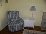 vintage chair and two drawer chest and lamp