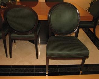 Large dining or conference room table.  Easily seats 12.   There are 2 additional leaves that can be added to the ends, extending the table further.  The leaves are in a custom wood case.  Includes table pads and table cloth.