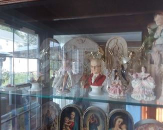 Assorted Collectibles In Glass Display Case