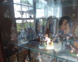 Assorted Collectibles In Glass Display Case