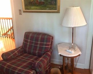 Plaid upholstered recliner and lamp stand -- hard for me to think of a sarcastic description for this: Agatha Christie "me space" starter kit? 