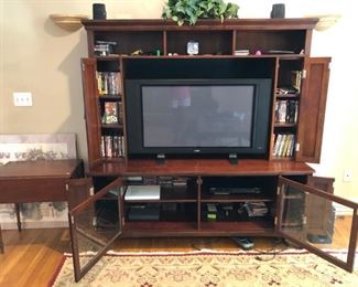 Entertainment center w/DVDs, CDs, flatscreen TV, Samsung DVD player, speakers 