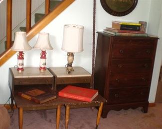 Pair of antique dresser lamps and an antique lamp. Oval antique picture in frame. Pair of step back end tables with marble tops, antique chest of drawers, coffee table books, including an bird book. 