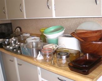 Baking tins, wood salad bowls, pyrex bakeware, toaster tupperware.