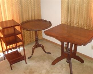Tall narrow shelf, round antique pedestal table, rectangular antique table.