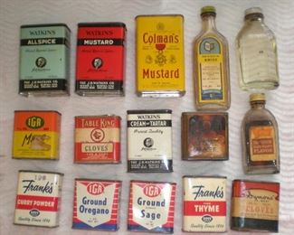 Lots of advertising spice tins and two flavor jars.