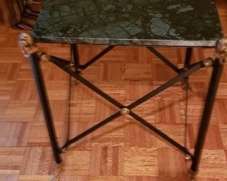 Green marble table with brass lion's heads at corners (see closeup in next picture