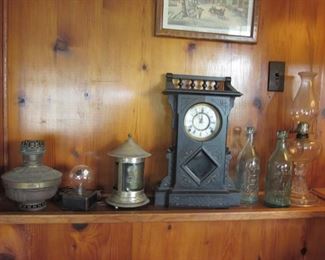 clock, oil lamp & bottles