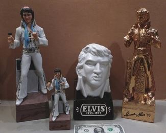 Elvis decanter music boxes....Very nice....The gold one has a 2 door blue swede display box it fits into.....