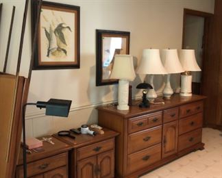 Large wood dresser with mirrors and 2 matching bedside tables.