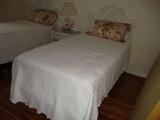 2 twin beds with pillow top matresses, wicker headboards