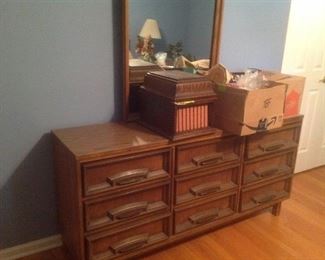 Part of a five piece bedroom set, this double dresser and mirror measure 64" long x 18" deep and 32" tall.  Mirror is 40" tall. Presale whole set is $235.  This piece is $80