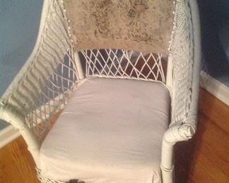 Wicker vintage rocker....has original fabric on back.