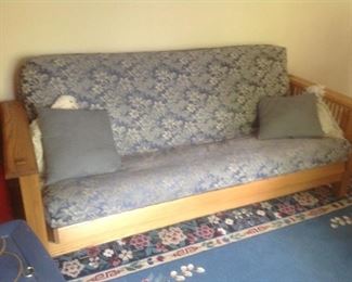 Futon...wood framed with blue and white pattern. Measures 84" long x 39" deep x 35" tall. Presale $110