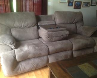 Reclining sofa with pull down center for drinks.  Measures 89" long x 43" deep x 38" tall.  Has matching chair recliners.  Presale on sofa is $150