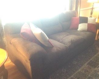 Brown overstuffed sofa with matching Loveseat.  Measuesc88" long x 38" deep x 31" tall.  Available presale at $95