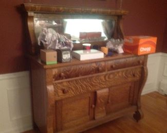 Antique buffet with mirror....55" wide x 24" deep x 59" high.  Some veneer has peeled on a drawer.  Presale  is $95.