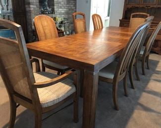 Drexel Heritage dining table with three leaves and 8 chairs with caned backs
