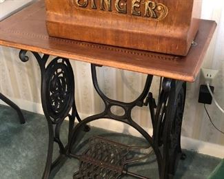 Circa 1900 Singer treadle sewing machine with original base and cover