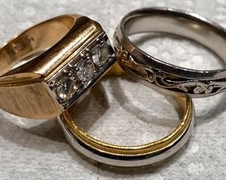 1. Gold and Diamond Men's Ring with 3 diamonds by IB Goodman 2. Platinum Engraved Wedding Band 3. 24 K and Platinum Wedding Band. I believe his fingers got too big for these and others were made!