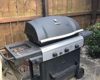 LARGE CHAR BROIL GRILL.  HAS SIDE BURNER AND COVER