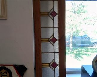 Wonderful edition to your home! Long horizontal stained glass window! Solid piece.
