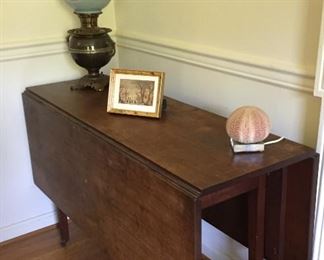 Drop-leaf Table and Victorian Lamp.