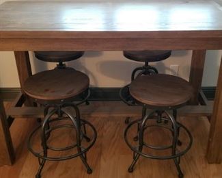 High, solid wood table and 4 industrial bar stools