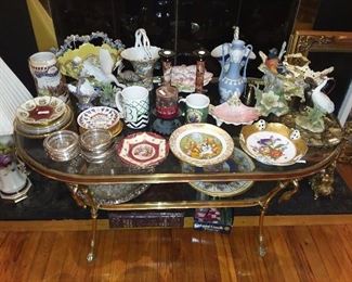 Assorted China On Glass Coffee Table