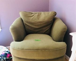 Olive green cozy swivel chair is a wonderful accent for any room. 