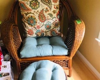 Pier One Chair and ottoman with a beautiful shade of blue cushions and an accent floral pillow.