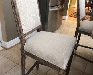Restoration Hardware Counter Stools in a beautiful flax linen cushion and a blonde wood trim.  There are two of them.