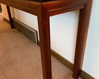 Incredible walnut console table with copper art detail.  57”W x 12”D x 24”T