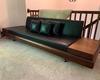 Stunning vintage Adrian Pearsall for Craft Associates 9’ walnut sofa Model 1709-S, reupholstered in the 70’s in a black Naugahyde, with original castors and 5 pillows