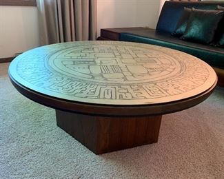 Very cool Mid Century Modern walnut coffee table with pressed silver top.  39 1/4” diameter