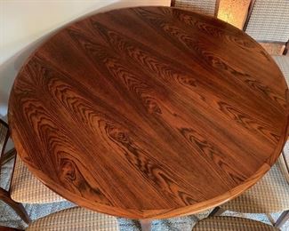 Vintage Danish Modern Moreddi rosewood dining set.  Expands from 49” diameter to 128” with all four leaves