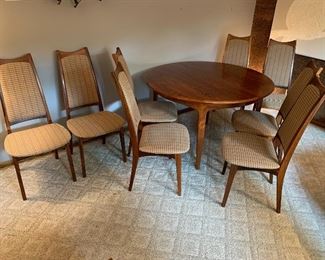 Vintage Danish Modern Moreddi rosewood dining set.  Expands from 49” diameter to 128” with all four leaves