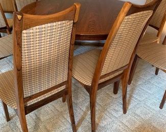 Vintage Danish Modern Moreddi rosewood dining set.  Expands from 49” diameter to 128” with all four leaves